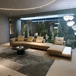 Fluid Curved Sectional Top-Grain Leather Sofa with Integrated Marble Side Platform